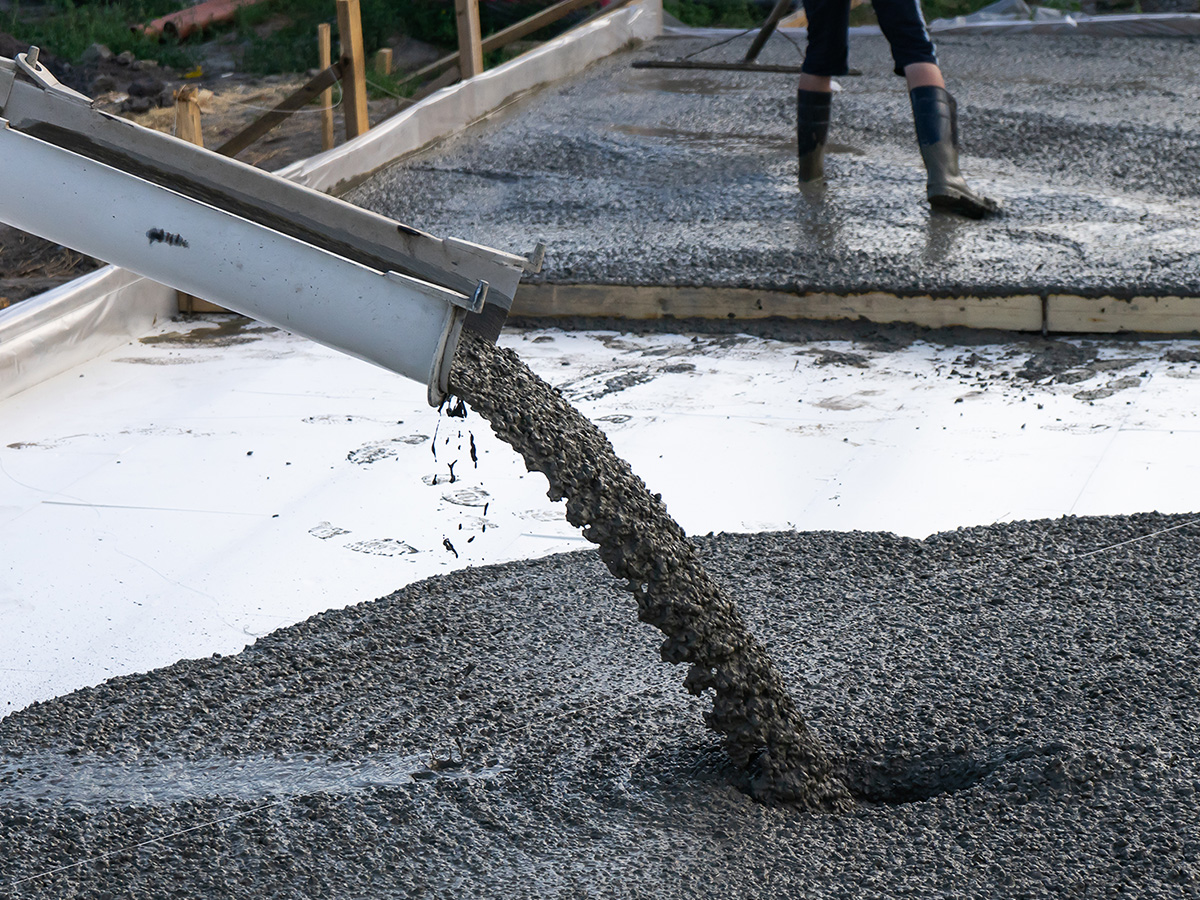 photo of fresh concrete being poured