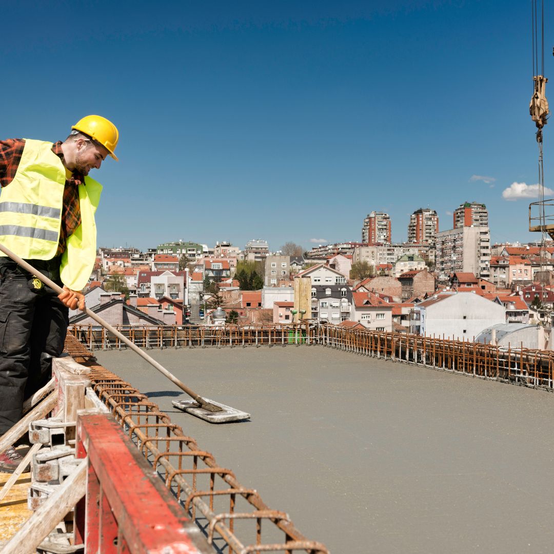 worker smoothing concrete